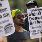 Demonstrators hold placards during a protest in support of the Windrush generation in Windrush Square, Brixton on April 20, 2018 in London, England (Photo by Chris J Ratcliffe/Getty Images)