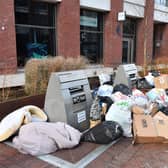 Bags of rubbish piled around uncollected waste bins outside a block of residential apartments in the Tower Hamlets. Photo: Getty
