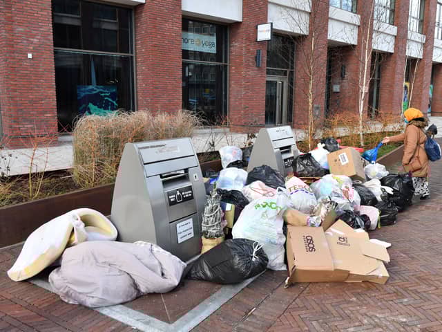 Bags of rubbish piled around uncollected waste bins outside a block of residential apartments in the Tower Hamlets. Photo: Getty
