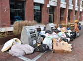 Bags of rubbish piled around uncollected waste bins outside a block of residential apartments in the Tower Hamlets. Photo: Getty