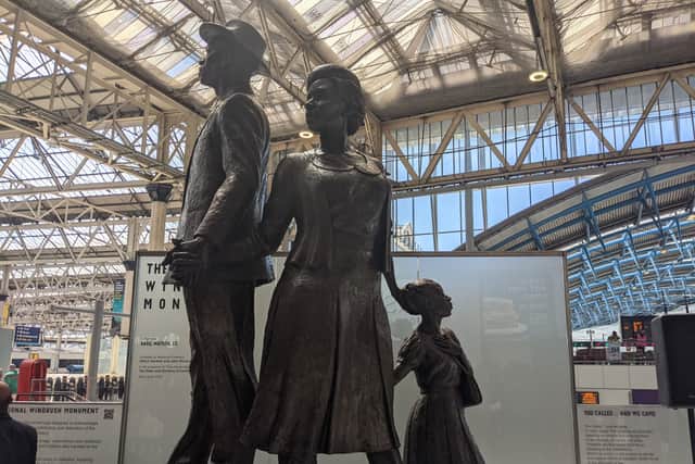 The statue, backed by £1m of government funding, portrays three figures – a man, woman and child – dressed in their “Sunday best” climbing a mountain of suitcases hand in hand.