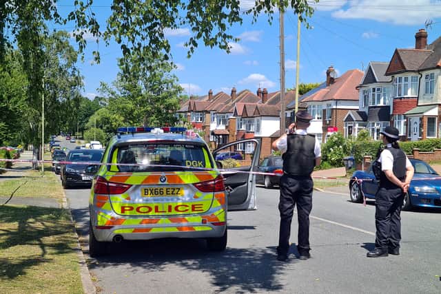 Police at the scene in Barnet, where a woman and her five-year-old son were stabbed to death. Photo: SWNS