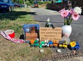 Tributes left at the scene in Brookside South, Barnet, to a woman and her five-year-old son who were stabbed to death. Photo: SWNS