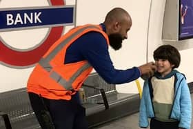 This is the adorable moment London Underground worker lets a train-obsessed toddler announce an incoming train. Credit: Ifat Batul Sementilli / SWNS