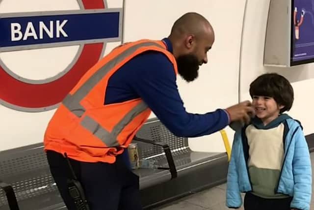 This is the adorable moment London Underground worker lets a train-obsessed toddler announce an incoming train. Credit: Ifat Batul Sementilli / SWNS