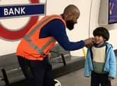 This is the adorable moment London Underground worker lets a train-obsessed toddler announce an incoming train. Credit: Ifat Batul Sementilli / SWNS