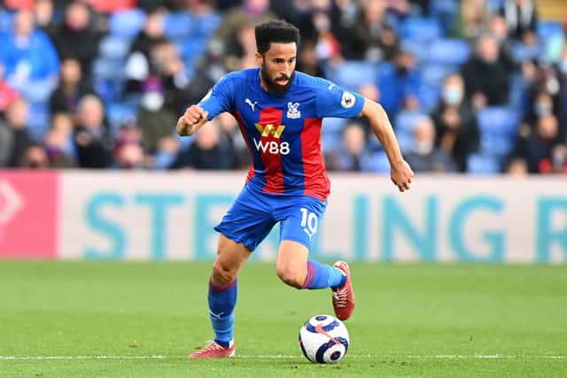  Andros Townsend of Crystal Palace runs with the ball during the Premier League match (Photo by Facundo Arrizabalaga - Pool/Getty Images)