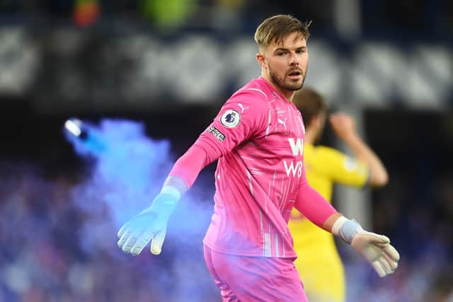 Jack Butland of Crystal Palace reacts as a flare is thrown onto the pitch during the Premier League match  (Photo by Michael Regan/Getty Images)