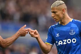 Everton's Brazilian striker Richarlison celebrates after shooting a penalty kick and scoring a goal  (Photo by PAUL ELLIS/AFP via Getty Images)