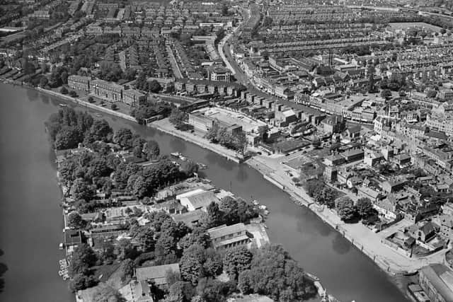 Aerial view of the River Thames with Eel Pie Island in centre and Twickenham town centre on right, West London, May 1955. Credit: Fox Photos/Hulton Archive/Getty Images