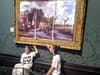 Just Stop Oil protesters glue themselves to National Gallery painting and cover it with ‘reimagined’ version