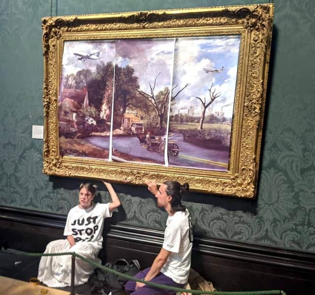 Activists Hannah Hunt and Eben Lazarus glued themselves to John Constable’s the Hay Wain at the National Gallery