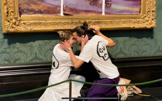 Just Stop Oil activists glue themselves to John Constable’s the Hay Wain at the National Gallery. Credit: Just Oil
