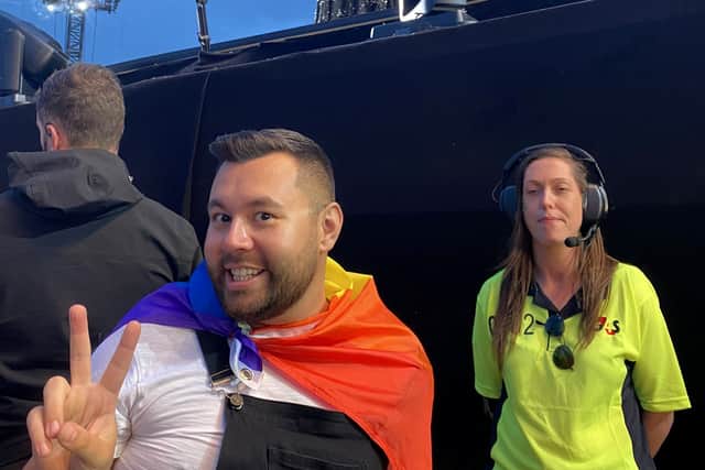 Dean Barber with his Pride flag at the Adele concert. Credit: Dean Barber / SWNS
