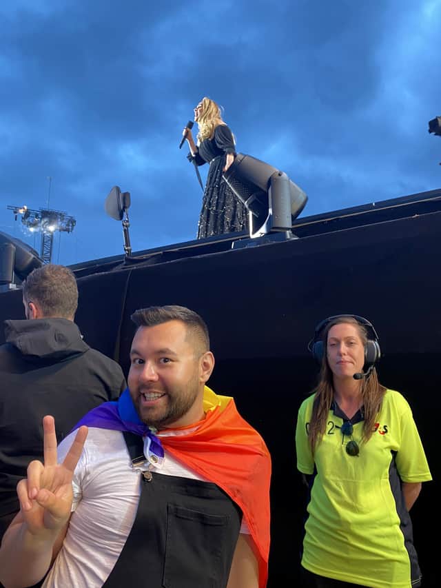 Dean Barber with his Pride flag at the Adele concert. Credit: Dean Barber / SWNS