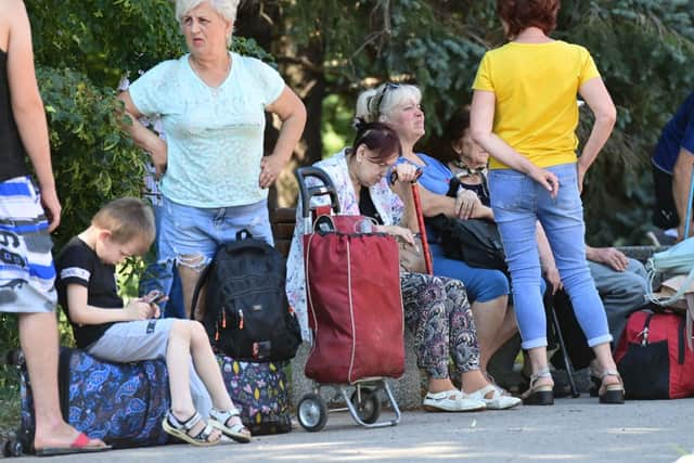 Ukrainian refugees fleeing Dnipro. Credit: MIGUEL MEDINA / AFP) (Photo by MIGUEL MEDINA/AFP via Getty Images