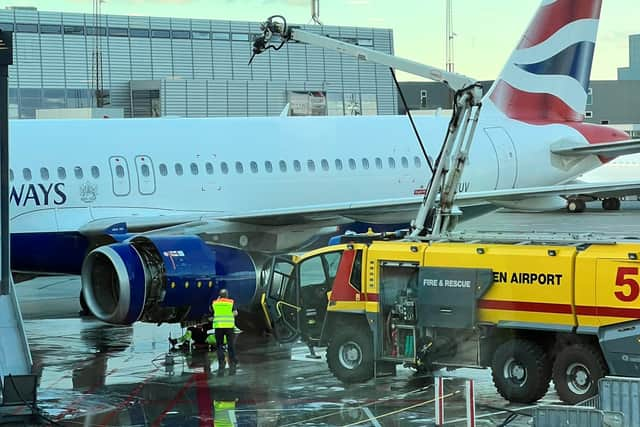 Dramatic scenes show firefighters tackling a fire on a British Airways passenger plane on Wednesday. Photo: SWNS