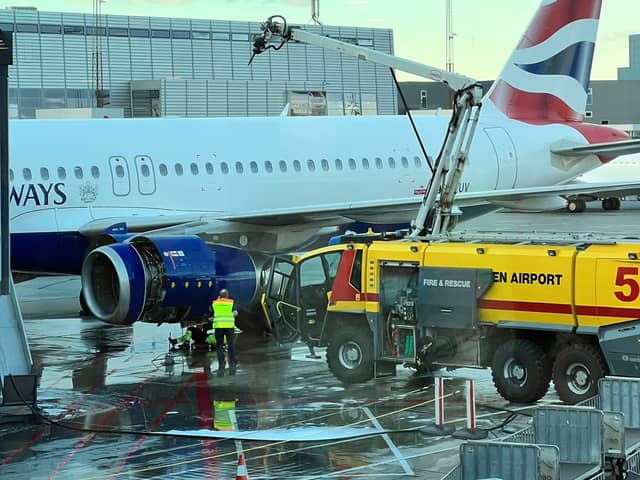 Dramatic scenes show firefighters tackling a fire on a British Airways passenger plane on Wednesday. Photo: SWNS