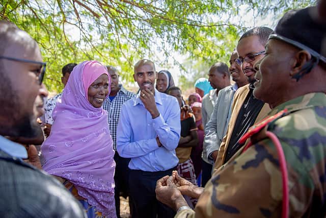 Sir Mo Farah with his mother Aisha, left, in Somalia. Credit: BBC/Atomized Studios/Ahmed Fais