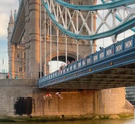 A dramatic video showing daredevil thrill seekers leaping from a central London bridge. Photo: Adam Szaniawski