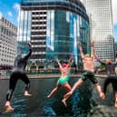 Swimmers enjoying the new open water venue at Middle Dock, Canary Wharf. Photo: Canary Wharf Group
