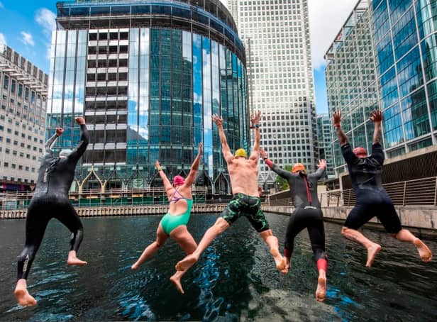 Swimmers enjoying the new open water venue at Middle Dock, Canary Wharf. Photo: Canary Wharf Group