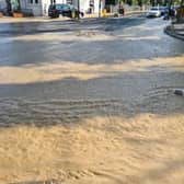 Dozens of firefighters are tackling a burst water main in Kingston-upon-Thames. Photo: LFB