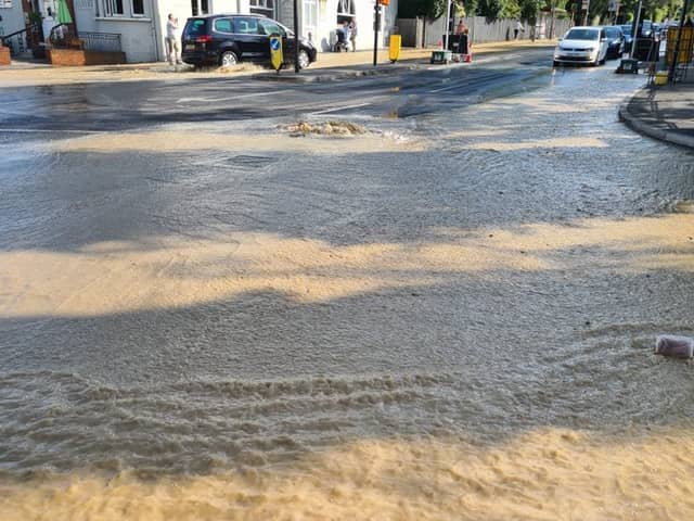 Dozens of firefighters are tackling a burst water main in Kingston-upon-Thames. Photo: LFB