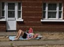 A woman sunbathes in Hackney ahead of the Met Office’s extreme weather warning. Credit: Hollie Adams/Getty Images