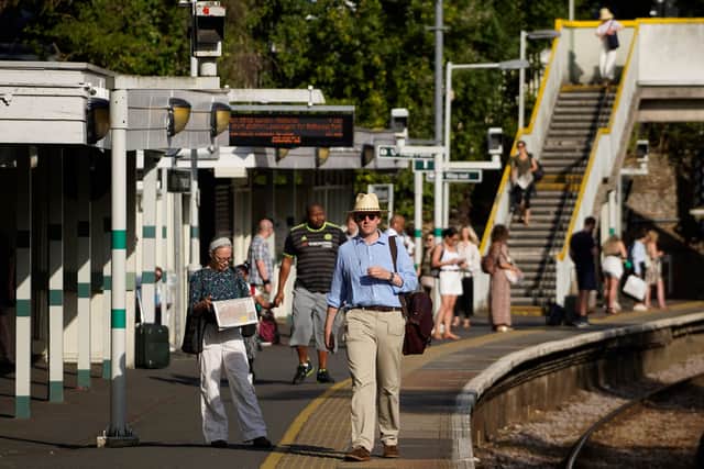 Six Tube lines along with the Elizabeth line, the London Overground and the Tram are delayed or suspended due to the extreme heatwave as of 9am on Tuesday, July 19. Pictured, commuters at South Norwood station. Photo: Getty