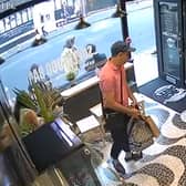 A man in a dark cap, pink polo shirt and sunglasses entered the Acai Berry cafe and stole Laura Luo’s bag. Photo: via Laura Luo