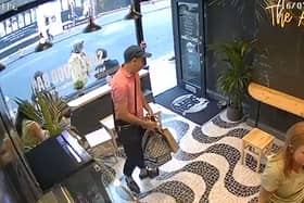 A man in a dark cap, pink polo shirt and sunglasses entered the Acai Berry cafe and stole Laura Luo’s bag. Photo: via Laura Luo