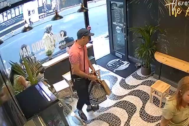 A man in a dark cap, pink polo shirt and sunglasses entered the Acai Berry cafe and stole Laura Luo’s bag. Photo: via Laura Luo