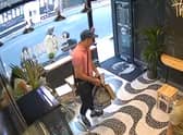 A man in a dark cap, pink polo shirt and sunglasses entered the Acai Berry cafe and stole Laura Luo’s bag. Photo: via Laura Luo