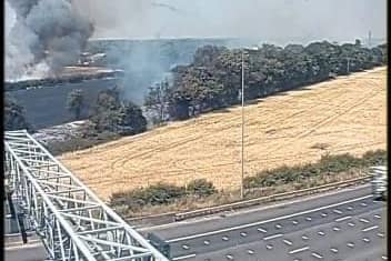 A Highways England image of the fire in Pea Lane, Upminster, from the M25. Credit: Highways England