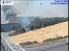 M25 fire: 175 firefighters tackling huge blaze in Upminster cornfield next to M25 & c2c has cancelled trains