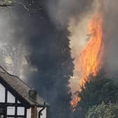 A fire has broken out along the railway tracks at Hatch End station in northwest London. Photo: Matthew Goodwin-Freeman