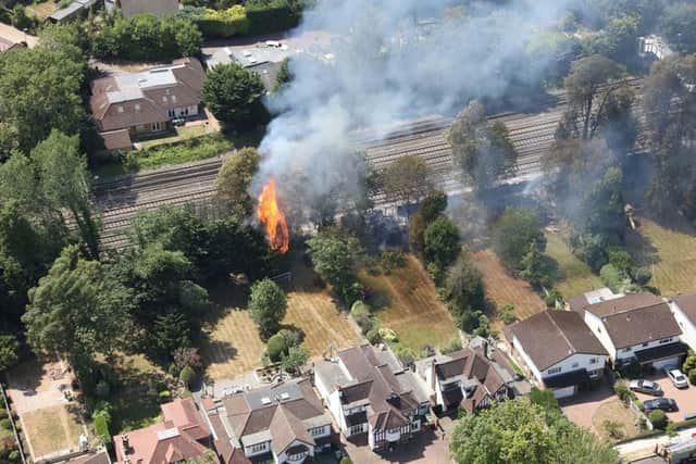 The fire next to the railway line near Hatch End station which has caused trains from London Euston to get cancelled. Credit: Network Rail