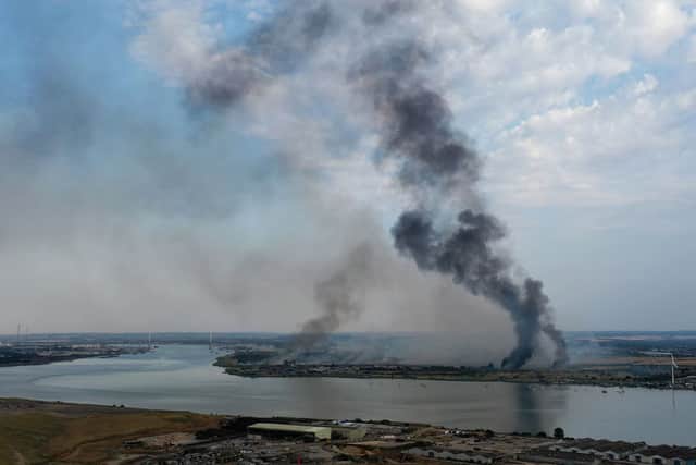 Smoke rising from fires in Dartford next to the River Thames on the hottest day on record. Credit: WILLIAM EDWARDS/AFP via Getty Images