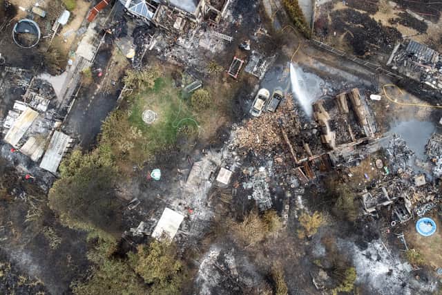 An aerial view shows the rubble and destruction in a residential area following a large blaze the previous day, on July 20, 2022 in Wennington, Greater London. (Photo by Leon Neal/Getty Images)