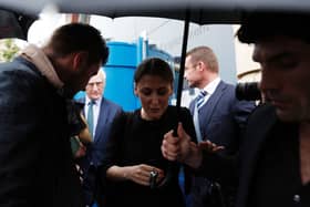 Marina Granovskaia (C) and Chelsea’s US chairman Bruce Buck (back L) are surrounded by media as they leave (Photo credit should read ADRIAN DENNIS/AFP via Getty Images)