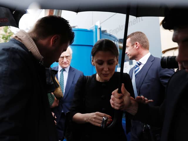 Marina Granovskaia (C) and Chelsea’s US chairman Bruce Buck (back L) are surrounded by media as they leave (Photo credit should read ADRIAN DENNIS/AFP via Getty Images)