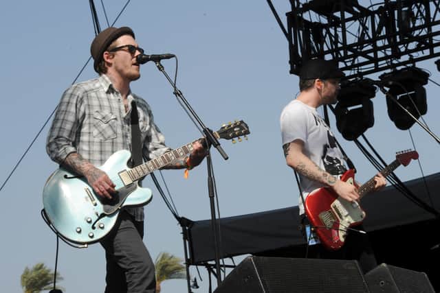 Musicians Brian Fallon (L) and Ian Perkins of the band The Gaslight Anthem perform onstage during day 3 of the 2013 Coachella Valley Music & Arts Festival