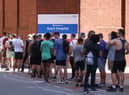 People line up to recieve monkeypox vaccinations at Guys Hospital in London (Image: Getty Images)