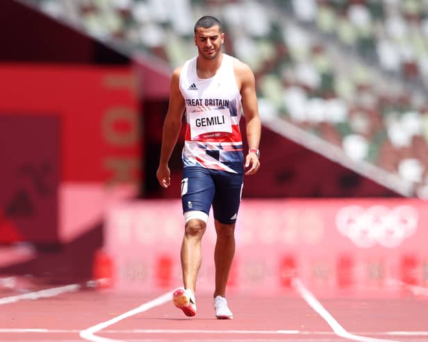 Adam Gemili of Team Great Britain walks during round one of the Men's 200m heats after an apparent injury on day eleven of the Tokyo 2020 Olympic Games at Olympic Stadium on August 03, 2021 in Tokyo, Japan.