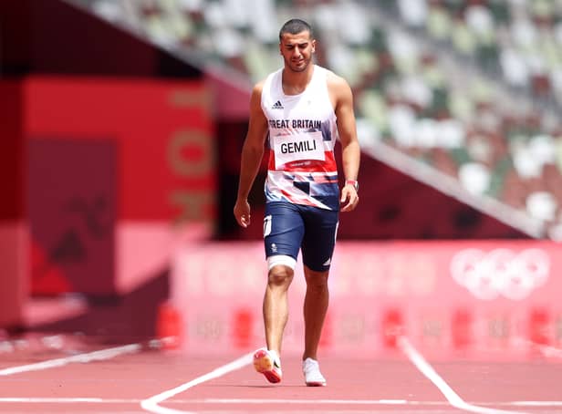 <p>Adam Gemili of Team Great Britain walks during round one of the Men's 200m heats after an apparent injury on day eleven of the Tokyo 2020 Olympic Games at Olympic Stadium on August 03, 2021 in Tokyo, Japan.</p>