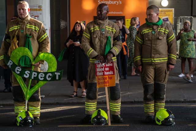 Firefighters take part in a Grenfell Tower tribute