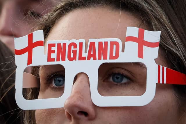 An England supporter watches the semi-final from the fan zone in Trafalgar Square