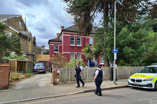 Police and forensics officers on the scene where a man in his 40s was killed in Tooting, south London, in the early hours of Wednesday July 27, 2022. Credit: SWNS 