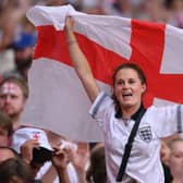 An England fan celebrates during the Lionesses 2-1 win over Germany in the Euro 2022 final. Credit: Mike Hewitt/Getty Images
